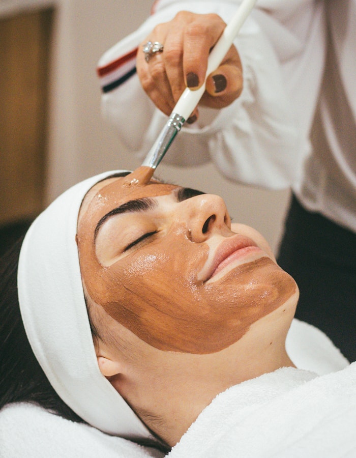 Beauty therapist providing a personalised facial treatment