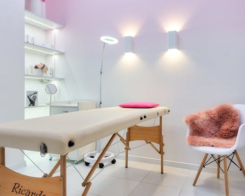 Beauty therapist preparing skincare products for treatment